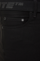 بنطال جينز بحزام مستوحى من المناطق الصناعية